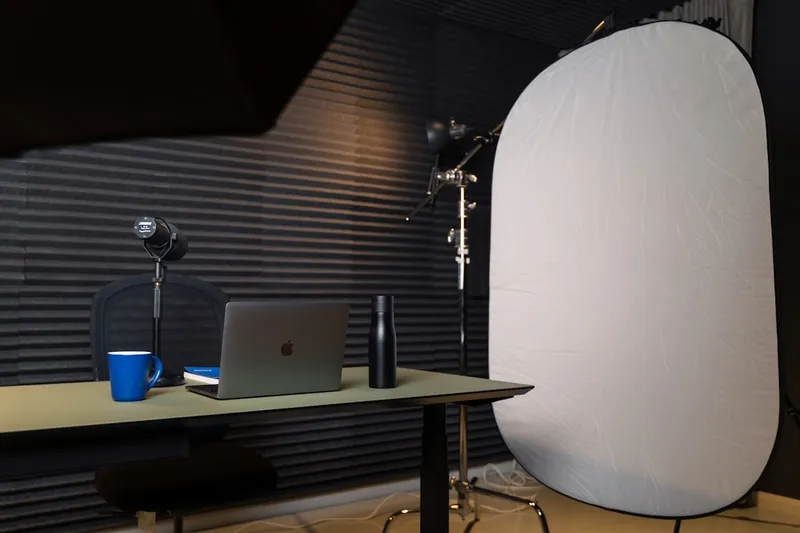 Studio with microphone, laptop and mug